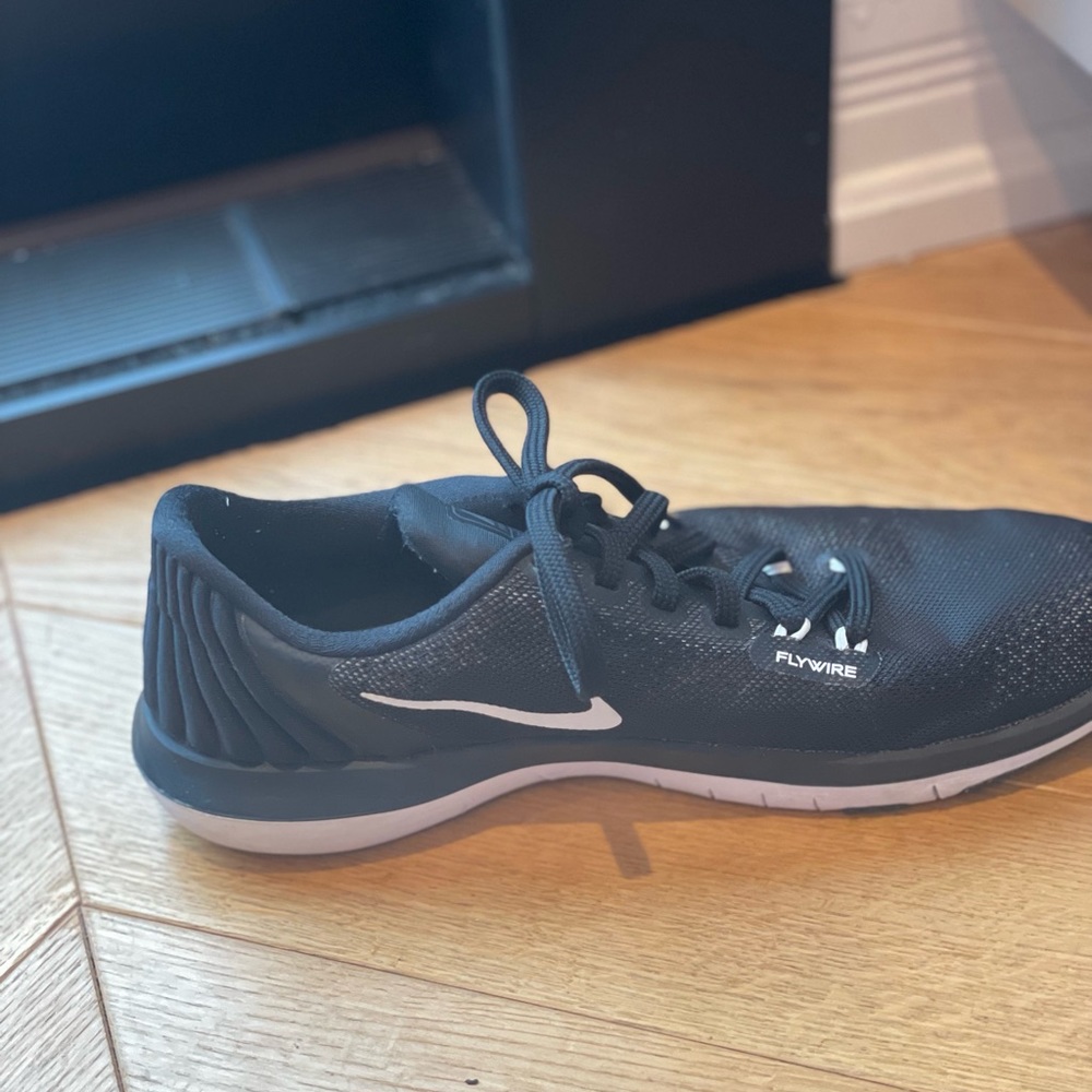 Nike Flywire black and whites women’s running shoes.